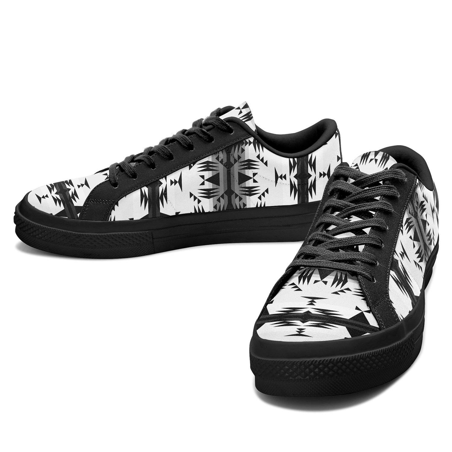 Between the Mountains White and Black Aapisi Low Top Canvas Shoes Black Sole 49 Dzine