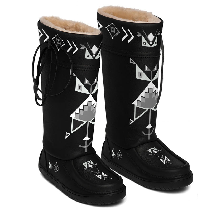 Owl Watcher black MocLux mukluks, pair at an angle, grey and white geometric print