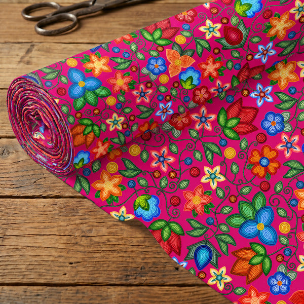 Morning Harmony Pink cotton poplin fabric rolled out on a wooden table